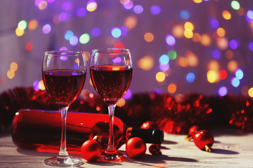 Wine and Christmas decoration on bright background