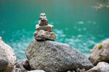 Cairn on the shore of a mountain lake