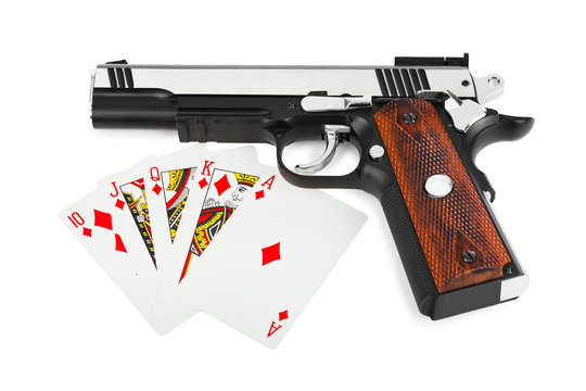 Gun and playing cards