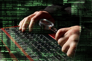hacker at work with graphic user interface around