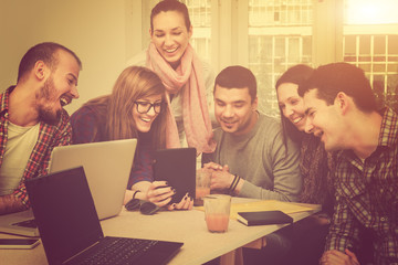 Young group of people discussing business plans.