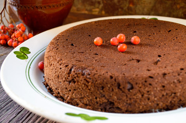 Homemade chocolate Christmas cake sprinkled with sugar powder