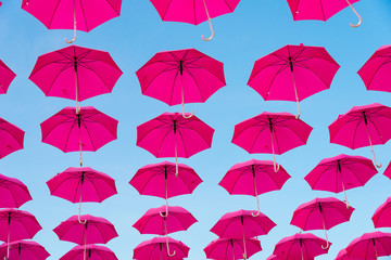 Many open umbrellas flying in the sky, giving idea of protection, Italy