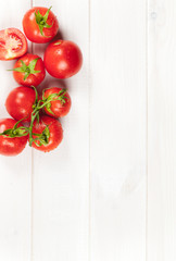 red tomatoes on wooden table