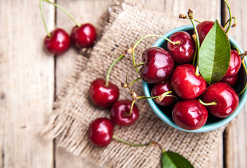 Cherry isolated on wooden background, fruits, berries