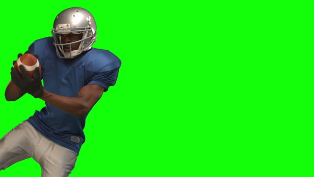 American football player catching ball 