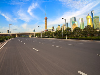 Empty road with Shanghai Lujiazui city buildings