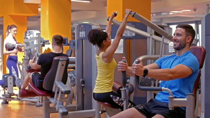 Fit people working out in gym - Powered by Adobe