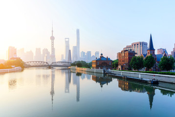 Fototapeta na wymiar landmarks and a bridge of shanghai on the shore