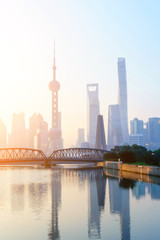 Naklejka premium landmarks and a bridge of shanghai on the shore