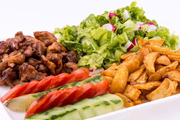 fried chicken with salad and potatoes - close up