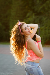 Pin-up girl with a lollipop and long hair.