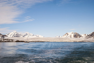 Sailing boat in front of the glacier in Svalbard, Arctic
