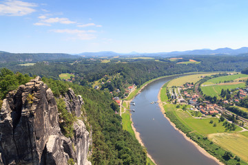 Fototapeta na wymiar Panorama view from rocks Bastei to river Elbe and Rathen, Saxon Switzerland