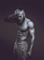 Obraz na płótnie Canvas Black and white picture of muscular guy.