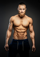 Obraz na płótnie Canvas Athletic muscular bearded guy.