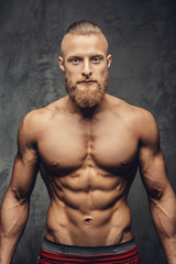 Fototapeta na wymiar Portrait of strong muscular guy.