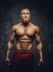 Obraz na płótnie Canvas Portrait of strong muscular guy.