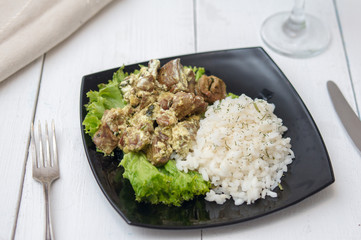 chicken liver with rice garnish