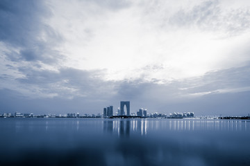 Naklejka premium channel with skyscrapers aside