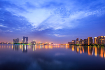 the surface of the river at dusk with metropolis