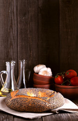 Bagel with poppy seeds in rustic style.