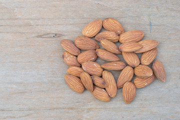 almonds on grained wood background