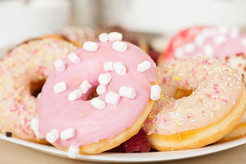  many   donuts on  plate.