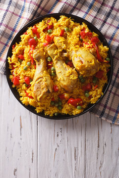 Spanish paella with chicken and vegetables. vertical top view
