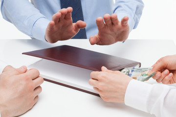 Business people taking a bribe on workplace