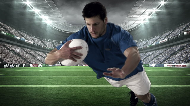Serious rugby player scoring a try