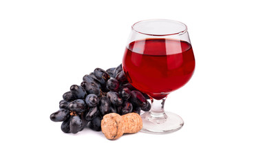 Bunch of fresh grapes, cork and glass of wine on a white background