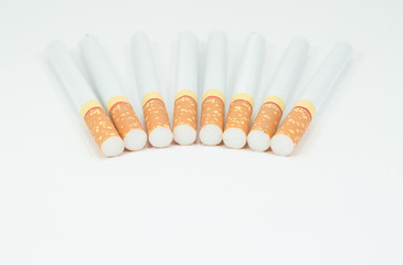 Smoking placed on a white background, focus cigarette butts.