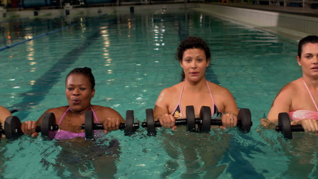 Pregnant women using weights in the pool
