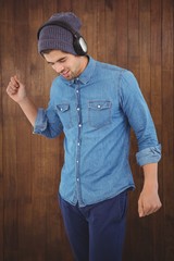 Hipster wearing headphones enjoying music