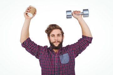 Fototapeta na wymiar Portrait of hipster holding dumbbells and disposable cup