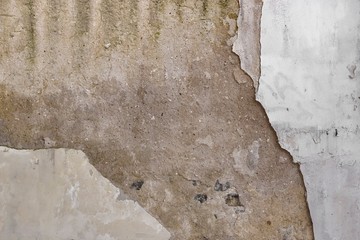 Old Grey Concrete Wall With Damaged White Paint Covering Backgro