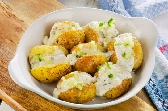 Baked potatoes with chives and cream.