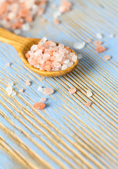 himalayan pink salt on wooden surface