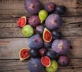 Fresh figs of different varieties, on metal plates.Toned image. Vintage style.Copy space.selective focus