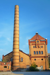 Fototapeta na wymiar Chimney and buildings of the old slaughterhouse in Poznan.