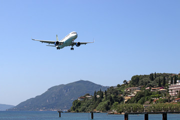 Fototapeta na wymiar Plane landing at the airport Corfu island Greece