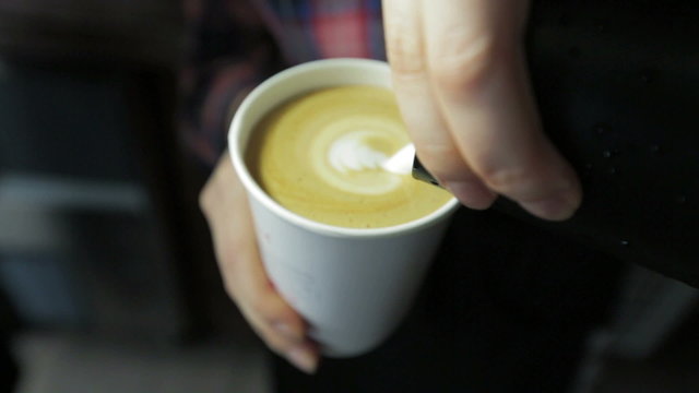 Pouring milk make latte art coffee