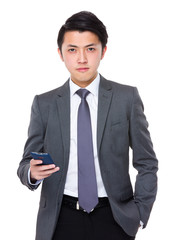 Asian Businessman hold with mobile phone