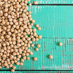 Chickpeas on a green background