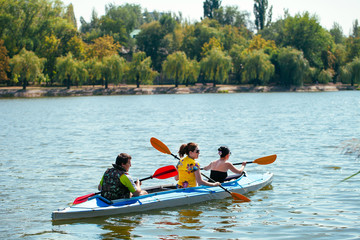 Young people in canoes. Family holiday.