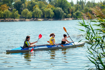 Young people in canoes. Family holiday.