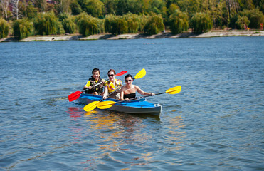 Young people in canoes. Family holiday.