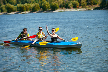 Young people in canoes. Family holiday.