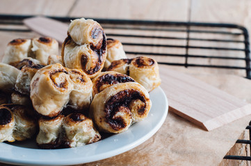 Puff pastry heart cookies on a baking paper